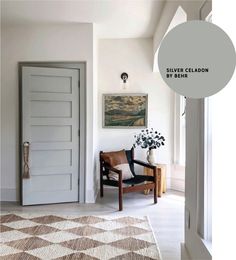 a living room with a chair and rug in front of a door that says silver cleadon by emik