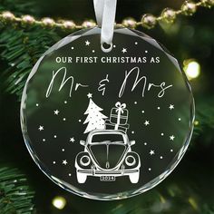 a glass ornament with a car and christmas tree on it that says our first christmas as mr and mrs