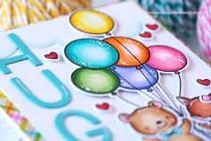 a close up of a greeting card with balloons on it and the words hug you