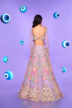 A tulle lehenga in lilac embroidered with 3D flowers, glass cut beads, sequins, evil eye beads, and plastic shells. Paired with an embroidered full sleeve georgette blouse in lilac with 3D flowers and a pink tulle dupatta.From Papa Don’t Preach’s Nazar Na Lage collection. DELIVERY TIMEPlease allow 8-12 weeks for your outfit to arrive. FABRIC DETAILSTulle, Georgette. Professional cleaning only. If I Was You Id Wanna Be Me Too, Glamorous Floral Embroidery Wedding Sets, Glamorous Wedding Sets With Floral Embroidery, Glamorous Floral Embroidered Sets For Reception, Glamorous Sets With Floral Embroidery For Reception, Purple Georgette Dress With Sequins, Purple Sequined Georgette Dress, Glamorous Embroidered Organza Sets, Purple Embellished Party Wear Dress