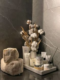 a bathroom counter with various items on it