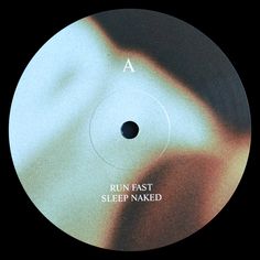 the label for run fast sleep naked on a black and white disc with an image of a