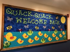 a bulletin board with ducks and butterflies on it that says quack, welcome back