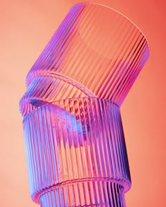 a purple vase sitting on top of a pink table next to a red wall and orange background