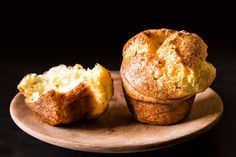 a muffin on a plate with another muffin in the middle and one half eaten