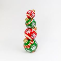 three christmas ornaments stacked on top of each other