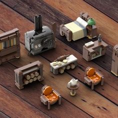 several different types of toy trains on a wooden floor