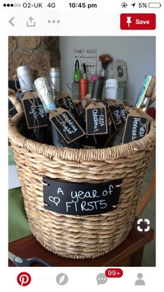 a basket filled with lots of items sitting on top of a table next to a pair of scissors