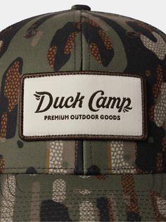 Look good, hunt good in a Duck Camp signature camo hat made of 100% Recycled Materials. Good for you, good for habitat. - Recycled materials make this hat better for everyone without sacrificing performance features- 6-panel structure- Snap back adjustment Outdoor Camouflage Baseball Cap, Outdoor Military Hat With Curved Bill, Military Hat With Curved Bill For Outdoor, Camouflage Flat Brim Trucker Hat For Outdoor, Camouflage Hats With Curved Bill For Outdoor Activities, Camouflage Hat With Curved Bill For Outdoor Activities, Outdoor Camouflage Snapback Hat With Flat Brim, Camouflage Snapback Hat With Curved Brim For Outdoor Activities, Camouflage Curved Brim Hat For Camping