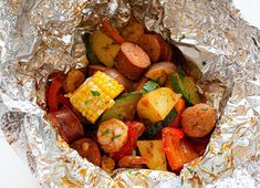 the food is prepared and ready to be eaten in the foil wrapper on the table