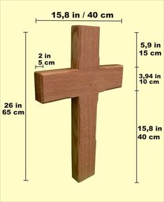 a wooden cross is shown with measurements