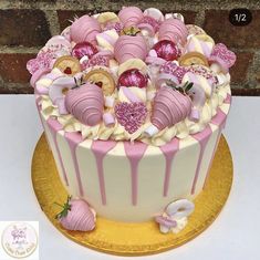 a cake with pink and white decorations on top