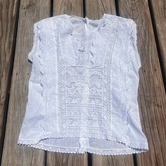 Beautiful vintage Edwardian style floral lace top. Overall great condition. Does have a very tiny repair near the collar where it looks like they used an off white thread instead of pure white. Semi sheer, lightweight. Buttons on the back of shirt. No brand or sizing. Measures 17" pit to pit and 21" nape to hem. Casual White Lace Patchwork Top, Casual White Tops With Lace Patchwork, Casual White Top With Lace Patchwork, Summer Lace Patchwork Short Sleeve Blouse, White Lace Patchwork Cotton Top, Summer Short Sleeve Blouse With Lace Patchwork, White Cotton Lace Patchwork Top, Summer Blouse With Lace Patchwork And Short Sleeves, White Cotton Lace Top With Patchwork