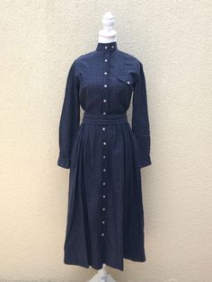 Lovely vintage long sleeve dress by Ralph Lauren in a navy blue color with an all over star-like red print. A-line skirt and a left side chest pocket. The dress is button down and the neckline has a two button closure, comes with a detachable belt that ties in the back. 100% cotton  Good vintage condition, no visible flaws.  Marked size 6.  For a proper fit please see the measurements below. Measurements (flat): Shoulder to shoulder: 16" Armpit to armpit: 17" Sleeve length: 21" Waist: 24" Hips: loose Shoulder to hem: 47" Skirt length: 31" EB8 Vintage Long Sleeve Dress, Side Chest, Romantic Cottage, Dress With Long Sleeves, Vintage Ralph Lauren, Navy Blue Color, Printed Dress, Dress Clothes For Women, Cottage Style