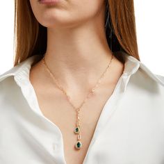 Express your elegance in chic style when you wear this pear-shaped green lab-created emerald and white lab-created sapphire frame double drop chain necklace. Crafted in sterling silver with 14K gold plate Two lengths of paper clip chain drops are each punctuated in a pear-shaped verdant-green lab-created emerald - the larger a 9.0 x 6.0mm stone. Shimmering white lab-created sapphires line the frames and open rectangle shapes above. This design suspends centered along a 17.0-inch paper clip link chain that secures with a lobster claw clasp. Elegant Emerald Teardrop Necklace, Elegant Pear-shaped Emerald Necklaces, Elegant Pear-shaped Emerald Necklace, Elegant Green Pear-shaped Necklace, Elegant Teardrop Emerald Necklace, Elegant Teardrop Emerald Gemstone Necklace, Fine Jewelry Pear-shaped Emerald Necklace, Drop Emerald Necklace For Formal Occasions, Elegant Pear-shaped May Birthstone Necklace