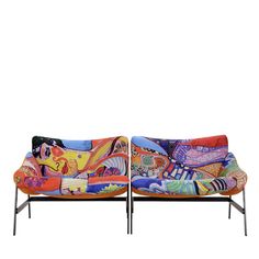 two colorful couches sitting next to each other