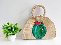 I love Mexico celebrates the native crafts of Mexico and the artists that produce them, enabling them and their communities to get recognized for their talented work and achieve economic stability for their families. This listing is for this bag shown on the picture, made of palm leaves and 100% natural materials. The tassels or other accessories on the picture are not included. The cactus paint is 100% made by hand. Measurements : please see pictures for exact size. All size units are in inches Palm Leaf Tote Beach Bag, Bohemian Bucket Beach Bag, Eco-friendly Palm Leaf Tote Beach Bag, Handmade Straw Bags With Beachy Style, Handmade Straw Beachy Bag, Bohemian Summer Straw Tote Bag, Summer Style Straw Bag, Handmade Multicolor Beachy Beach Bag, Summer Tropical Bag In Natural Color