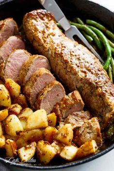 meat and potatoes in a skillet with green beans