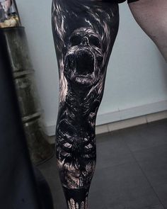 a man's leg with an image of a gorilla on it and his mouth open