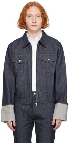 Non-stretch denim jacket. · Spread collar · Zip closure · Flap and welt pockets · Rolled cuffs · Adjustable button tabs at back hem · Contrast stitching in tan Supplier color: Raw indigo Fitted Denim Jacket With Pockets In Rigid Denim, Fitted Denim Blue Jacket With Welt Pockets, Fitted Denim Jacket With Pockets, Spring Denim Outerwear With Selvedge Detail, Spring Selvedge Denim Outerwear, Fitted Dark Wash Denim Jacket With Welt Pockets, Fitted Denim Jacket With Welt Pockets, Fitted Denim Outerwear With Button Cuffs, Fitted Dark Wash Outerwear With Welt Pockets