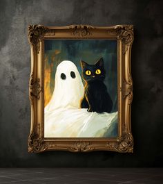 a black cat sitting next to a white ghost in a gold frame on a wall