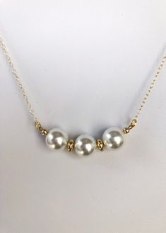 Pretty medium sized white pearls are separated by 2 small gold plated disks hangs from a delicate gold filled chain and has a lobster clasp. Feminine Women, Gold Filled Chain, Necklace Gold, Pearl White, Lobster Clasp, Gold Filled, Gold Necklace, Gold Plate, Etsy Accessories