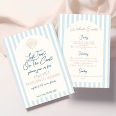 two blue and white striped wedding programs with seashells on the front one is folded