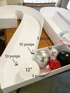 an odd shaped table with balls in it and measurements for the top part of the table