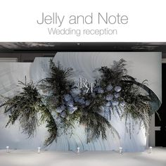 an advertisement for a wedding reception with flowers and greenery in front of the entrance