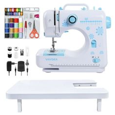 the sewing machine is sitting on top of a table next to markers, pens and scissors