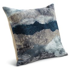 a blue and gray pillow on a white background