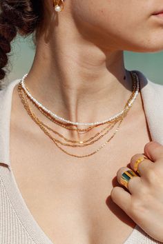 A dainty new classic, the Kala'i Paperclip Chain Necklace is a stunning addition to your collection. Made from 18kt Gold Filled, this popular paper clip style chain is versatile, elegant necklace is a striking statement worn alone or with a bevy of other beauties. ✦ DETAILS ✦ ✧ Name: Kei (KEH ee) - One's pride and glory. ✧ You will receive one necklace. ✧ Links measure 2mm x 5.5mm each. ✧ 18kt Gold Filled with a spring clasp. ✧ All Ke Aloha Jewelry pieces come packaged thoughtfully, beautifully, Tiny Pearl Necklace, Hawaii Jewelry, White Pearl Necklace, Initial Jewelry, Trombone, Pearl Choker, Pearl Charms, Elegant Necklaces, Pearl Chain