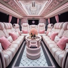 the inside of a limo with pink and white furniture