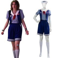 a woman in sailor outfit standing next to a mannequin wearing shorts and socks