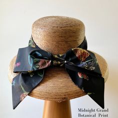 Our signature Middy Bow hat band is a removable hatband and bow combination that fits all of our ladies hat styles. The bow hatband is easily removable via a hidden closure and can be switched out for a different band in a matter of seconds, allowing you to mix and match hat shapes and bands to curate your own signature sun hat collection. Hidden Velcro dots hold the band securely in place on the hat. This listing is for one Middy Bow Hatband only. Hats shown below are the Meadow Hat, Tailored M Elegant Adjustable Hat With Bow, Adjustable Bow Boater Hat For Kentucky Derby, Adjustable Boater Hat With Bow For Kentucky Derby, Chic Adjustable Hats For Kentucky Derby, Elegant Brimmed Sun Hat With Bow, Elegant Brimmed Boater Hat, Chic Adjustable Brimmed Top Hat, Elegant Hat Bands One Size Fits Most, Chic Adjustable Wide Brim Top Hat