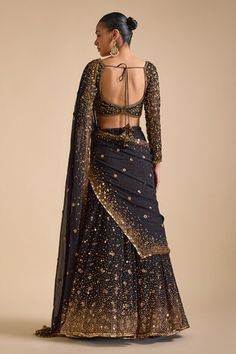 Black can can attached lehenga featuring sequin bead floral scatter motifs highlighted by sequin gradient hemline. Comes with padded floral sequin embroidered blouse and sequin embellished tasselled dupatta. - Aza Fashions Sequin Beading, Embroidered Blouse, Aza Fashion, Lehenga, Floral, Black