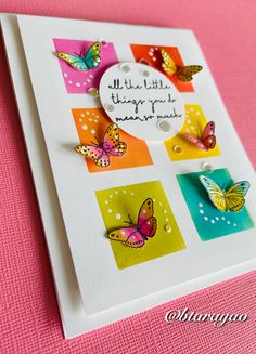 a close up of a card with butterflies on it