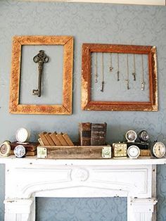 there are two frames on the mantle with books and keys next to each other in front of them