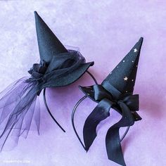 two black witches hats with stars on them