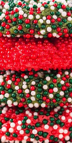 red, white and green beads are stacked on top of each other