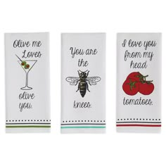 three kitchen towels with different designs on them