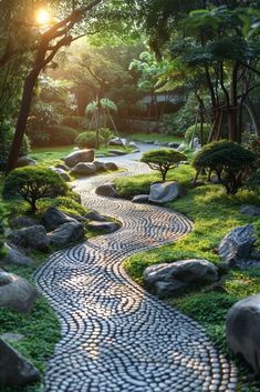 a stone path in the middle of a lush green park with trees and rocks on either side