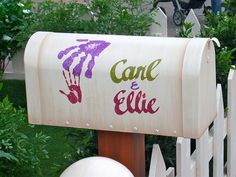 a mailbox with the word cane and eliie painted on it's side