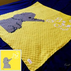 a crocheted blanket with an elephant on it and a yellow border around the edges