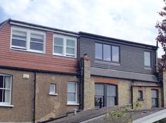 a row of houses with windows on each side