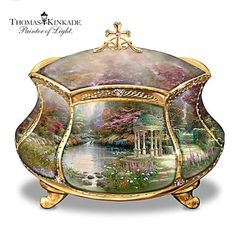 a decorative box with an image of a gazebo in the middle and flowers around it