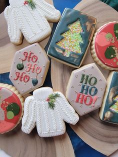 decorated christmas cookies sitting on top of a plate