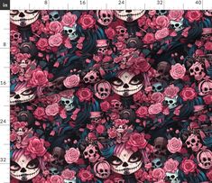 skulls and roses on black fabric with pink flowers in the background, as well as a ruler