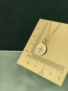 "Solid Gold Compass Necklace, Compass Jewelry, 14K Solid Gold Dainty Pendant, Personalized Gift, Layered Necklace, Traveler Gift ♥ Material of pendant and chain: Solid Gold 14K ♥ Packaging: All of our jewelry is beautifully boxed and ready for gifting For more personalized designs take a look here: ♥ www.etsy.com/listing/631444472 ♥ www.etsy.com/listing/645292671 ♥ www.etsy.com/listing/645282627 ♥ www.etsy.com/listing/631455364 ♥ www.etsy.com/listing/645278199 ♥ www.etsy.com/listing/645276341 ♥ Everyday Gold Jewelry With Compass Design, Sterling Silver Yellow Gold Necklace With Compass Design, Minimalist Gold Compass Design Jewelry, Compass Design Pendant Jewelry As Gift, Gold Minimalist Compass Design Jewelry, 14k Gold Compass Design Jewelry Gift, Yellow Gold Charm Necklace With Compass Design, Sterling Silver Yellow Gold Compass Design Necklace, Yellow Gold Compass Design Charm Necklace