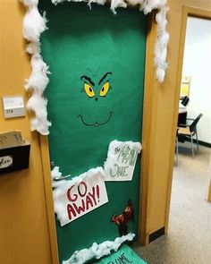 a door decorated to look like the grinch from how the grinch stole christmas